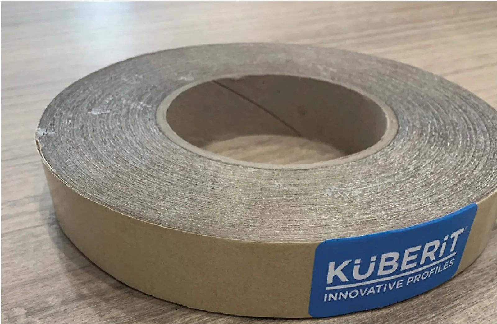 Kübi-Tape being applied to a flooring substrate